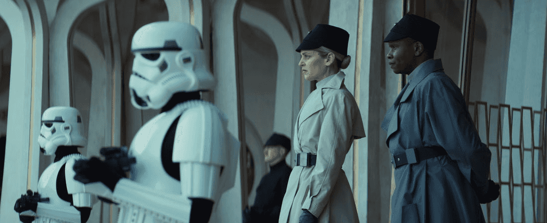 (Second from Left - R) Dedra Meero (Denise Gough) and Grymish (Kurt Egyiawan) in Lucasfilm's ANDOR Season 2, exclusively on Disney+. ©2025 Lucasfilm Ltd. & TM. All Rights Reserved.